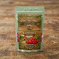 Harvested freeze-dried raspberries in a light green mylar pouch